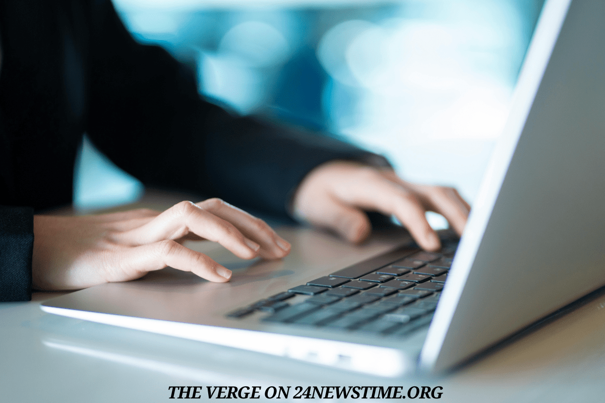 Modern workspace showing laptop with tech news website open